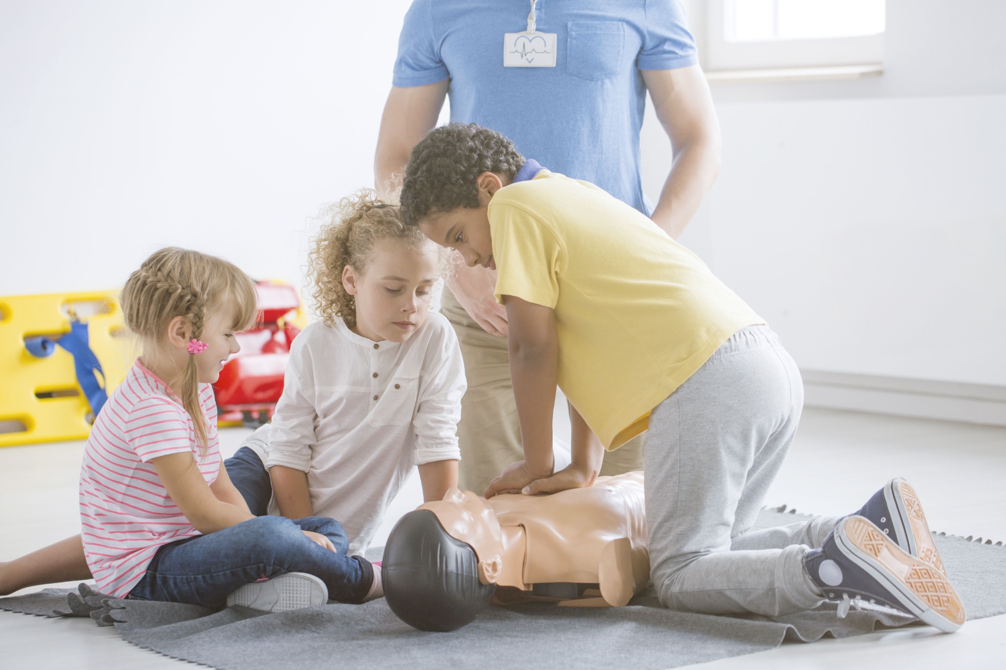 Children learning CPR